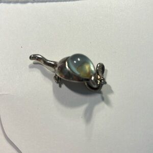 Silver mouse with green stone brooch